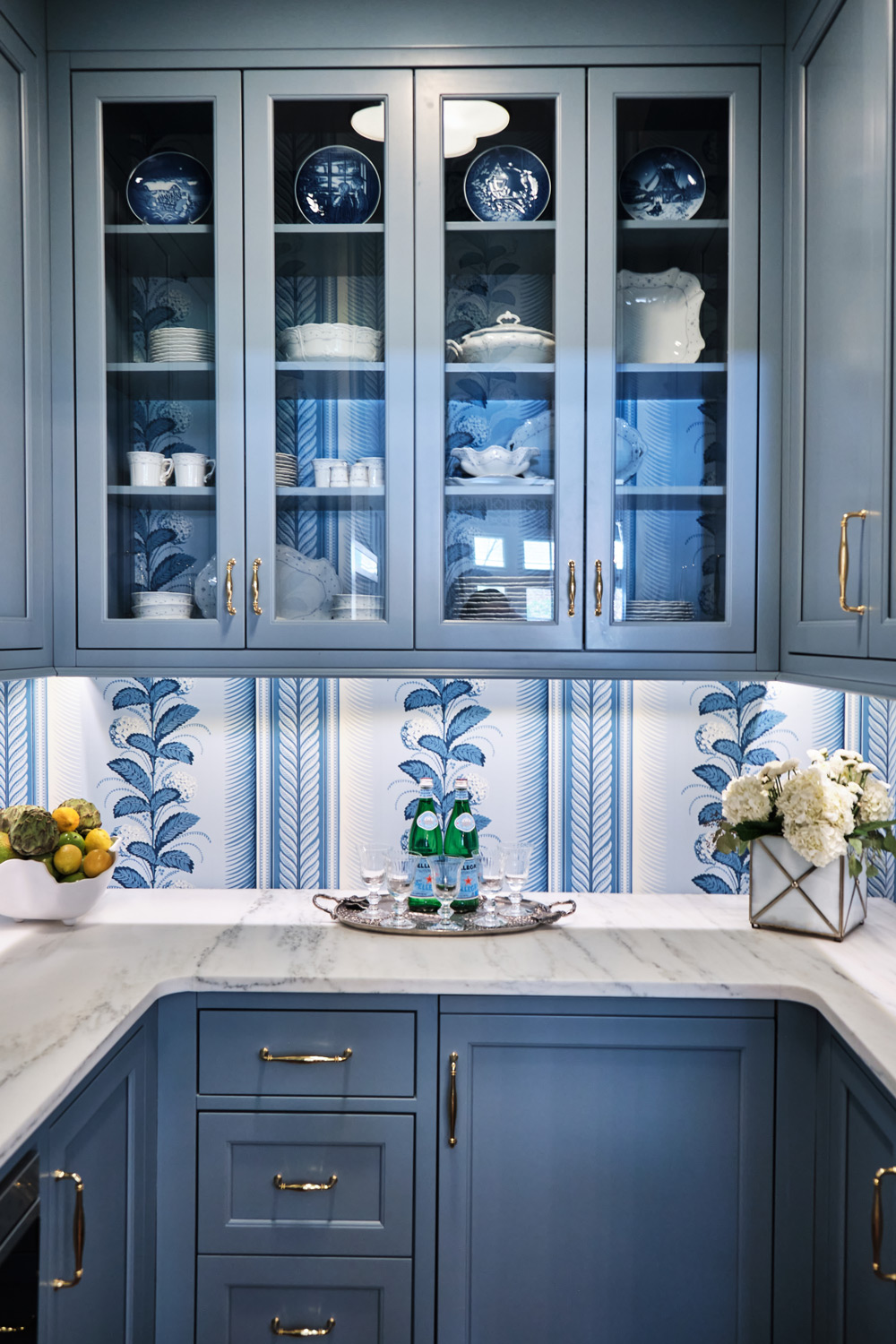 blue cabients display blue china in the pantry