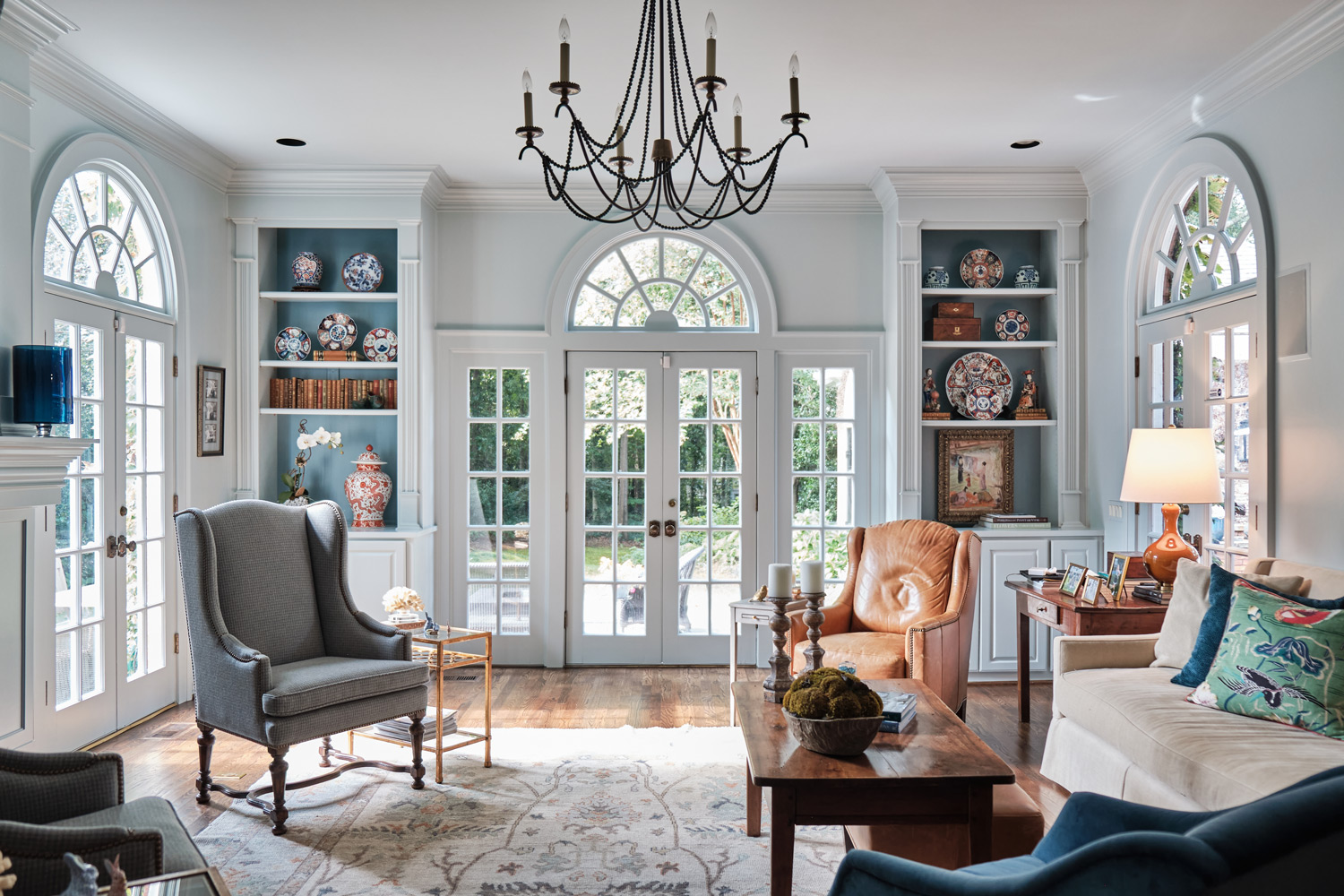 the living room showing blue paint accents that carry throughout the house