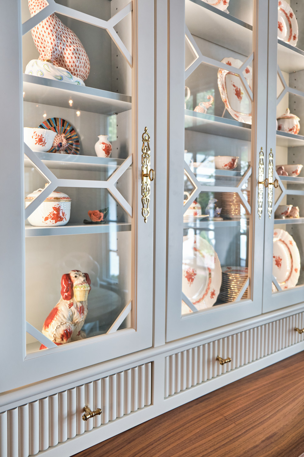 a detailed view of the hutch cabinets with ribbed drawer and gold hardware